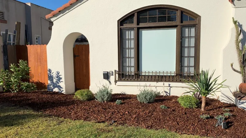 The planting design compliments the stunning Spanish architecture of this home. 