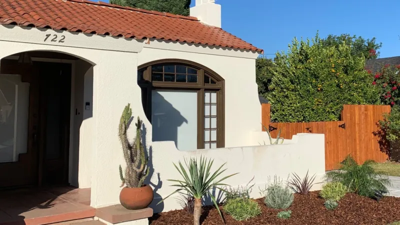 The planting design compliments the stunning Spanish architecture of this home. 