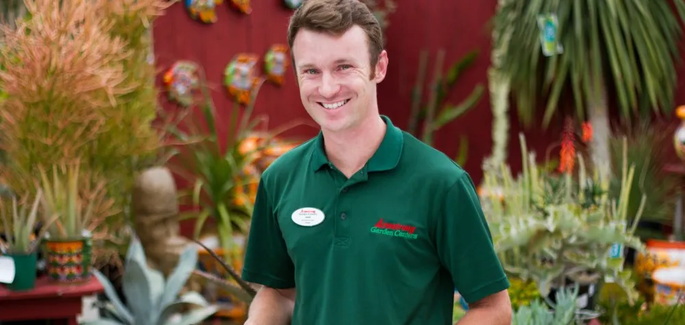 Male Armstrong Associate in garden center