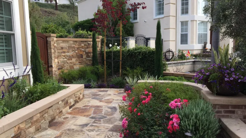 Beautiful, luxurious hardscape surrounded by lush greenery