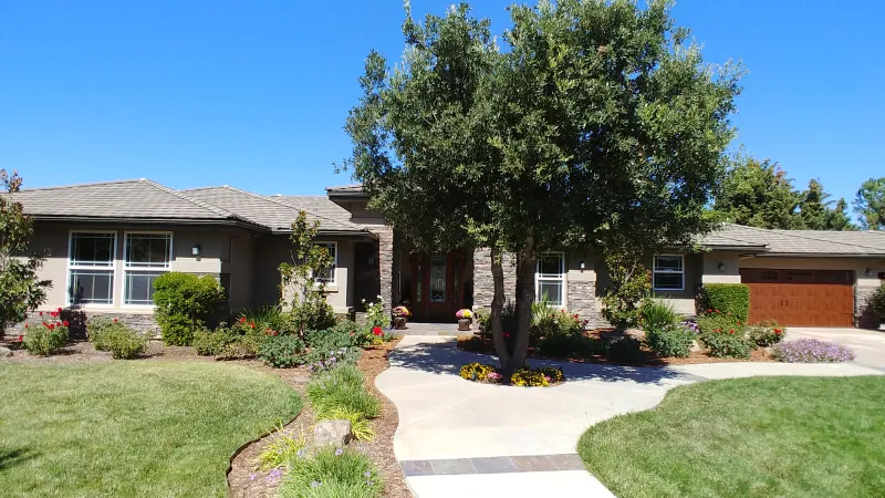 Elegant ranch style home and landscape.
